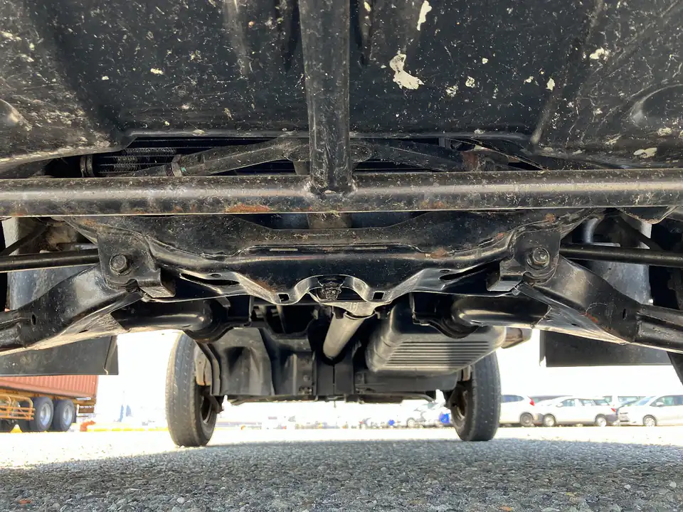 Underbody of a Subaru Sambar Kei Truck showing surface rust on the frame rails
